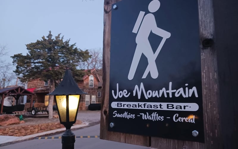 Joe Mountain Breakfast Bar sign at dawn in Medicine Park